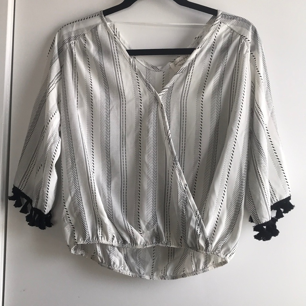 White/Black Top with fringe on the sleeves